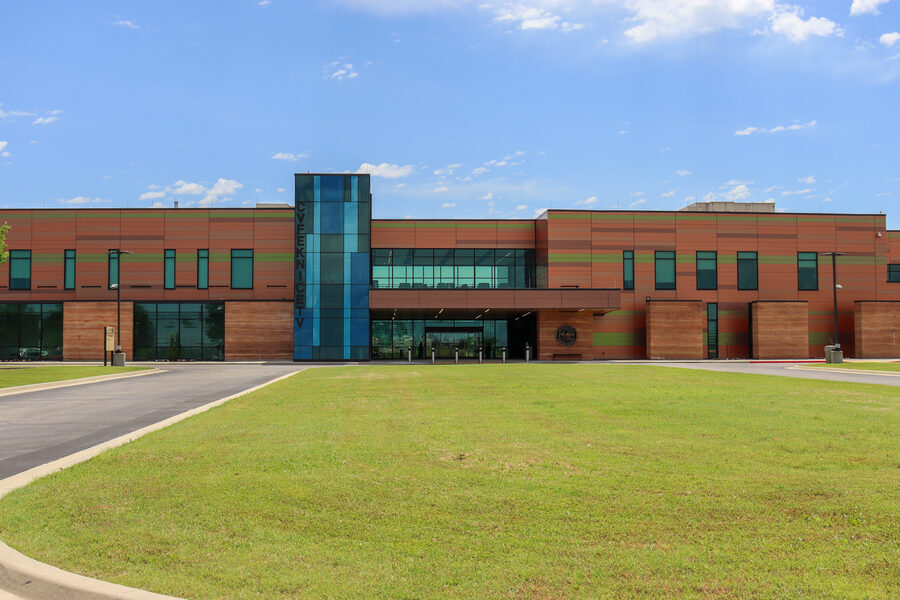 Exterior of a Muscogee (Creek) Nation tribal health facility in Oklahoma, featuring the nation's seal above the entrance