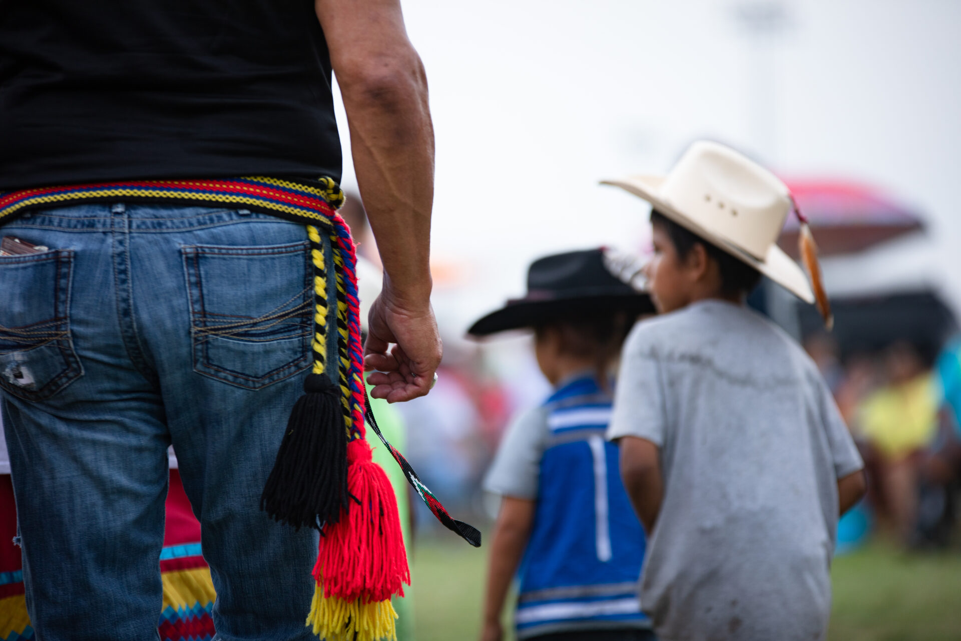 Adult community member with children at a Muscogee (Creek) Nation community health event in Oklahoma